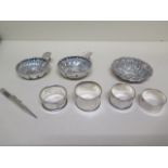 Two Continental silver porringers - 77mm and 72mm diameter, four silver napkin rings, a silver