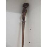 A carved figural walking stick - Length 83cm - in good condition and good colour