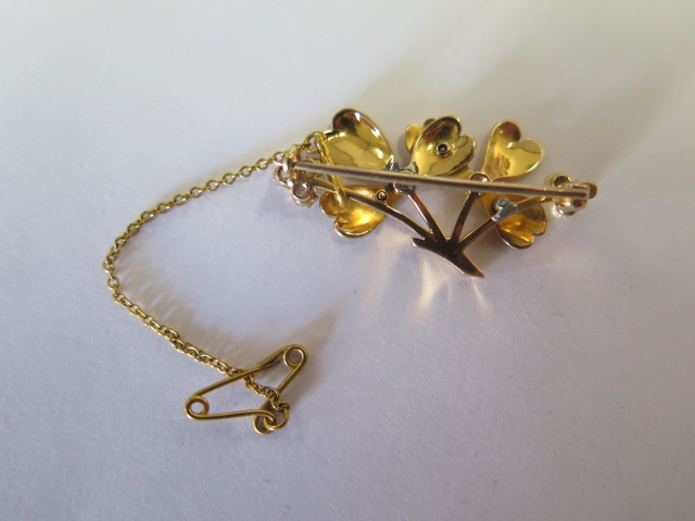 A brooch comprising two floral forms in yellow and rose gold each set with a single old cut - Image 2 of 2