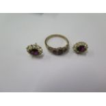 A 9ct hallmarked yellow gold ring size N with a pair of near matching earrings possibly garnets -