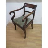 A Regency mahogany scroll arm carver chair