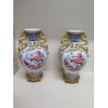 A pair of Franklin Mint Blessings of the Imperial Dragon vase by Anne King nos 0256 and 0271 -