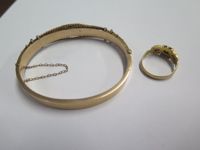 A 9ct hallmarked yellow gold bangle - 6.5cm x 5.5cm external - approx weight 12 grams and a - Image 2 of 3