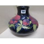 A large Moorcroft blue ground Anemone vase - Height 20cm - crazing to base, otherwise good condition