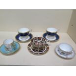 A Crown Derby Imari 1128 cup and saucer, a Caverswall blue tit cup and saucer, a Dresdan cup and