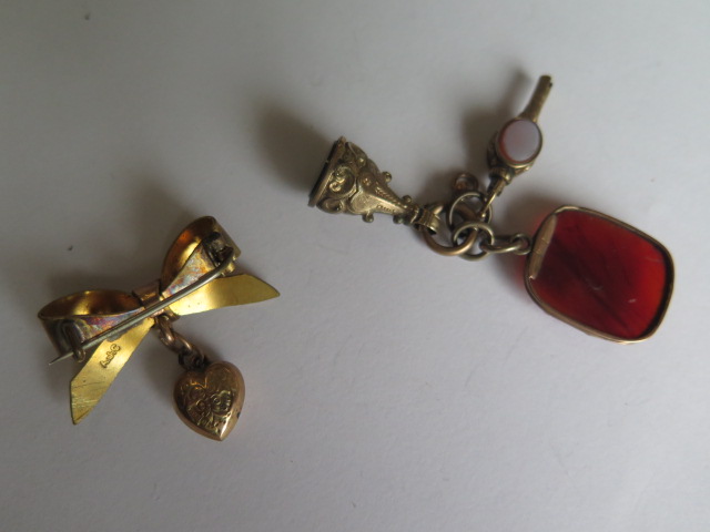 A gilt metal pin brooch, gilt metal Chinese pendant, gilt metal fobs and watch key and a gilt - Image 6 of 6