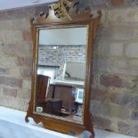 A mahogany wall mirror - in good condition - Height 67cm x Width 40cm