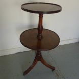 A Georgian mahogany dumb waiter with three out swept reeded legs with a good colour and condition