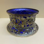 An Irish silver Shepard and Shepardess fretwork silver sleeve with blue glass liner - Dublin 1932,