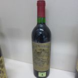 A bottle of Chateau de la Riviere 1975 - level good