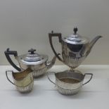 A matched silver four piece coffee/tea set - teapot and milk jug London CSH 1895/96 with armorial