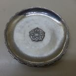 An Omar Ramsden silver Arts and Crafts hammered circular pin dish with applied rose head and