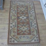 A small hand knotted woollen Milas rug - 160cm x 85cm - generally good