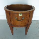 A 19th century oval mahogany and inlaid wine cooler with a brass liner - Width 38cm x Height 46cm