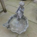 A lead garden bird bath