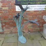 A garden feature of three flying ducks - Height 150cm