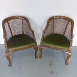 A pair of mahogany bergere chairs on cabriole legs - in good condition