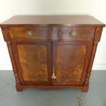A 19th century mahogany chiffonier with a single drawer over three cupboard doors missing its back