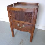 A Georgian mahogany bedside cupboard with a sliding tambour door - Height 80cm x Width 50cm