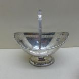 A silver Victorian helmet shaped basket with pierced border - London 1877/88 HH - Length 16cm -