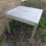 A weathered hardwood garden table - 80cm Square