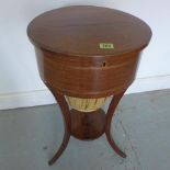 An Edwardian mahogany and inlaid workbox on three outplayed legs