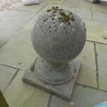 A stone effect ball finial - Height 47cm