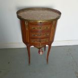 A late 19th/20th century oval three drawer chest with a slide - Height 78cm