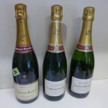 Three bottles of Laurent Perrier Champagne