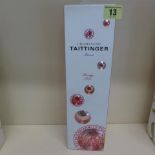 A boxed bottle of Tattinger Champagne