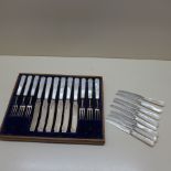Six silver and Mother of Pearl cake forks and knives and eight silver and Mother of Pearl knives -