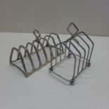 Two silver toast racks - Largest 10cm long - some slight bending to both otherwise no damage -