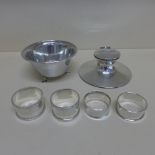 A silver hammered bowl, four silver napkin rings and a capstan inkwell - missing interior and slight