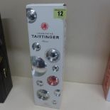 A boxed bottle of Tattinger Champagne