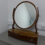 A Georgian mahogany bow fronted dressing table mirror with three drawers - Width 55cm