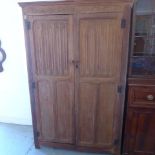 A limed oak wardrobe with linen fold doors split in two for easy transport - Width 115cm x Height
