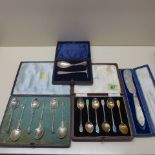 A boxed set of six enamel silver Walker and Hall coffee spoons - generally good, silver pusher and