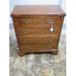 A Georgian style walnut bachelors chest with a fold over top over four long drawers - Height 73cm