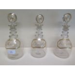 Three Georgian glass decanters Hollands Brandy and Rum - Height 23cm - one with cracked top and