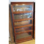 A mahogany five section glazed Globe Wernicke stacking bookcase, two sections with labels, one