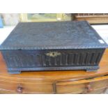 An 18th century carved oak box - Width 60cm x Depth 42cm x Height 22cm - good condition for its age