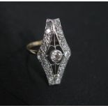 An Art Deco yellow gold and white metal diamond ring with a central diamond approx 4mm x 2mm, 0.25ct