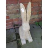 A hand carved limestone hare - 9.5cm x 31cm x 61cm tall