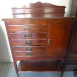 An early 20th century mahogany set of five filing drawers