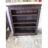 A 1930's oak bookcase with a carved front - Width 91cm x Height 107cm x Depth 28cm