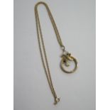 A 9ct gold pendant on a gilt metal chain - total weight approx 5.8 grams