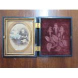 A Victorian coloured photograph of two children in an ornate case - 7.5cm x 6.5cm - good condition