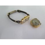 A 9ct yellow gold manual wind ladies wristwatch on a leather strap - running - total weight approx