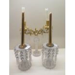A pair and a single glass candlesticks