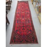 A handmade Persian runner - in good condition - 290cm x 83cm